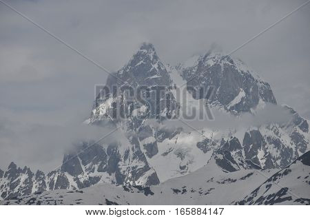 Ushba peak in the Caucasus Mountains. Snowy playing.