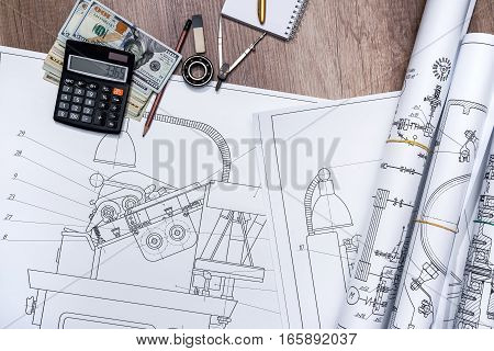 The drawing machine pencil ruler us dollar and compasses