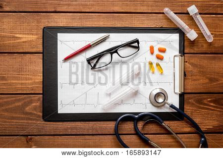 doctor workplace at wooden table with microscope in lab top view no one