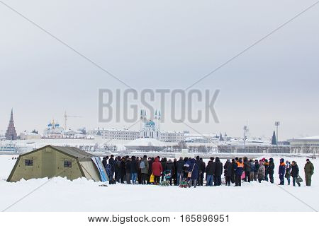 KAZAN, RUSSIA - JANUARY 19, 2017: Jesus Christ's baptism holiday on kazanka river. Traditional winter bathing in center of city, telephoto