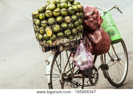 Oranges on a bicycle on the streets of Ho Chi Minh City, Vietnam