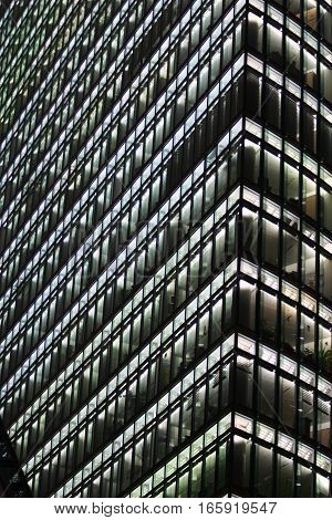 BERLIN, GERMANY - 30 JANUARY 2005: Abstract full frame details of a modern business skyscraper at night.