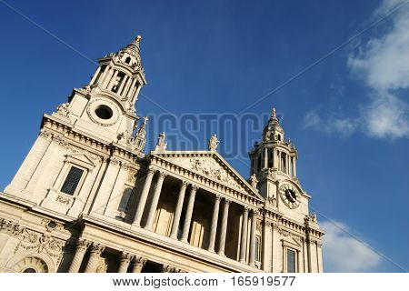 St. Paul's Cathedral, London, UK. Façade to the iconic London landmark set against a blue sky.