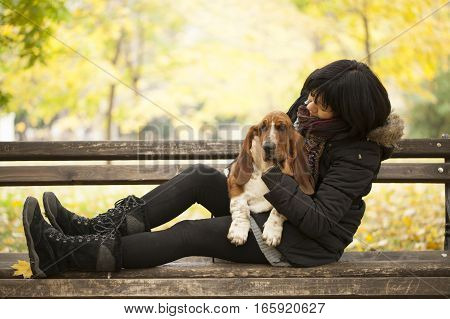 The woman with a dog in the park Selective focus and small depth of field lens flare