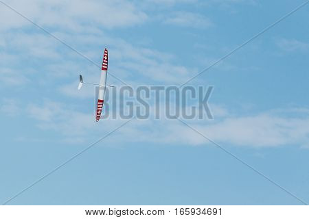 RC remotely controlled soaring plane model sailplane on blue sky in brisk wind