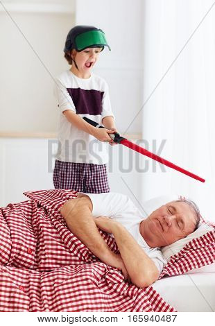Naughty Yelling Grandson Waking Grandpa Up By Playing Around In Loud, Noisy Games