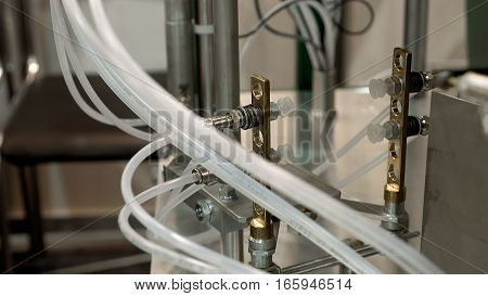 Tanks and containers connected with tubes pipes and valves. Laboratory at food brewing production factory plant. Chemical research tests are important in any production process.