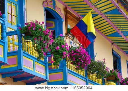 September 23, 2016 Filandia, Colombia: colonial style wooden balconies decorated with blooming flowers in the centre of the coffee producing small town
