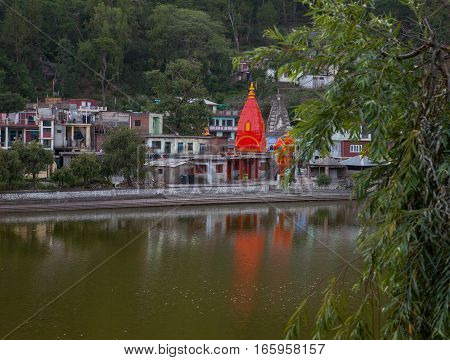 REWALSAR, INDIA. 2 June 2009: The temples reflected in the lake Revalsar. District Mandi, Himachal Pradesh, district of Kangra, India.