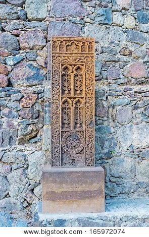 The old khachkar with fine patterns at the wall of Geghard Monastery Kotayk Province Armenia.