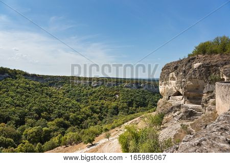 View of the South secret gate in the medieval town-fortress Chufut-Kale and the gorge Maryam-Dere