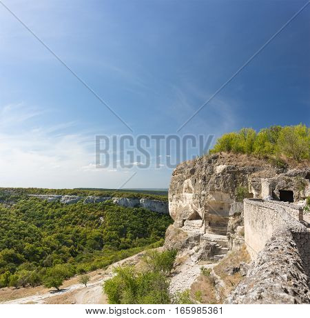 View of the South secret gate in the medieval town-fortress Chufut-Kale and the gorge Maryam-Dere