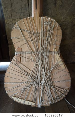 unfinished classical guitar in rural luthier shop in Ecuador