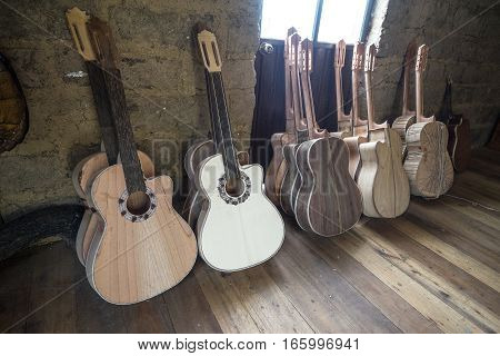 July 22, 2016 San Bartolome, Ecuador: classical guitars in various finishing stages in small rural luthier shop