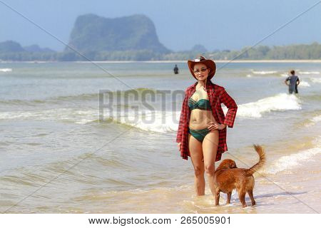 Woman With Bikini And Dog Outdoor On Beach At Bang Beot Beach, Chumphon Province Thailand