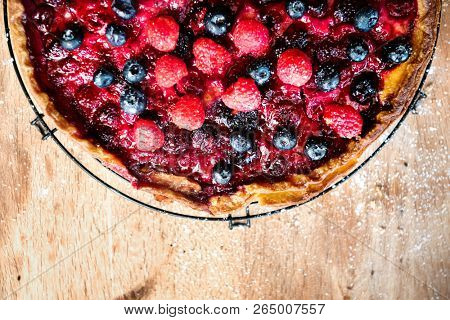 Homemade berry pie on a wooden table