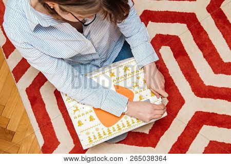 Paris, France - Jan 5, 2018: Overhead View From Above Of Curious Fashionable Woman Opening The Cardb