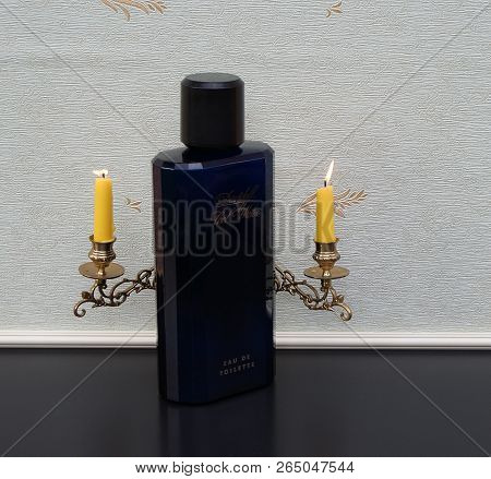 Davidoff Cool Water, Eau De Toilette, Large Perfume Bottle In Front Of A Piano Candelabra With Shini