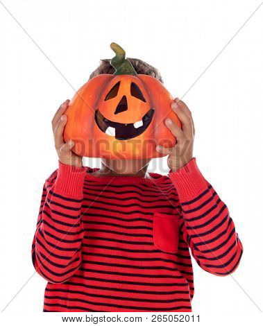 Happy latin boy holding a big pumpkin isolated on a white background