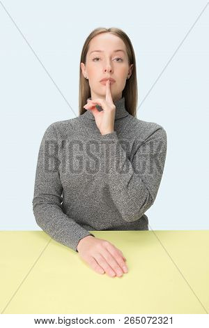 Shhhhh. Beautiful Girl With Bright Makeup And Curly Hair Telling A Secret. Portrait Of Woman Who Is 