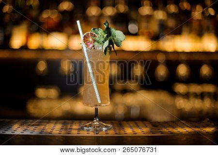 Elegant Cocktail Glass Filled With Tasty Sherry Cobbler Drink Decorated With Mint, Straw And Orange 