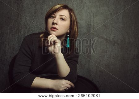 Vintage Portrait Of Beautiful Stylish Pensive Girl With Turquoise Earrings And Vinyl Record In Hands