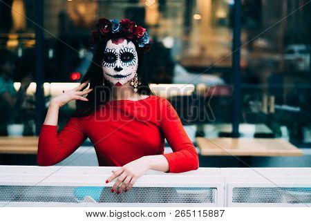 A Girl With A Painted Face Of A Skeleton, A Dead Zombie, In The City During The Day. Day Of All Soul