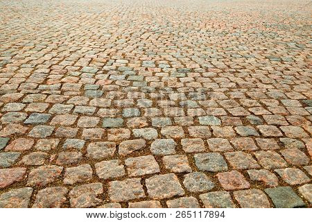 Wet Gravel On The Ground. Wet Road Of Stones. Natural Background.  Natural Paving Granite On Road. W