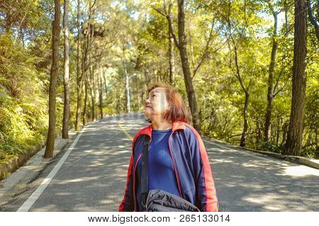 Beautiful Senior Asian Women Walking In The Xiqiao Mountain Park Foshan China,china Travel