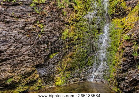 Little Waterfall In Green Summer Mountains, Norway.