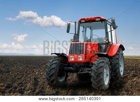 The Tractor - modern farm equipment in field