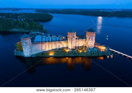 View Of The Ancient Olavinlinna Fortress On A July Night (aerial Survey). Savonlinna, Finland