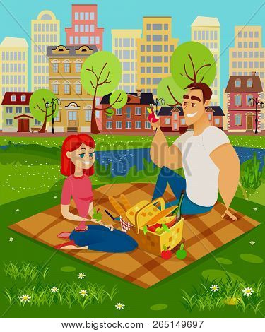 Picnic Outside The City. A Man And A Woman Are Sitting On The Grass, In Front Of Them There Is A Bas