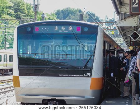 2016 May 05. Tokyo Japan. Parking Okutama Line Train With Passenger To Travel In Famous Natural Plac