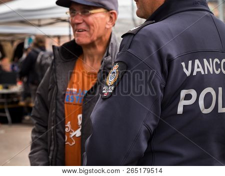 Vancouver, Bc, Canada - May 11, 2016: Vancouver Police Officer Conversing With A Member Of The Publi
