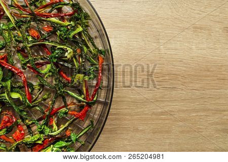 Dry Red And Green Bell Pepper On Wood Background. Space For Text