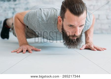 Workout And Exercise. Man Doing Push Ups. Chest Muscles And Biceps Training.