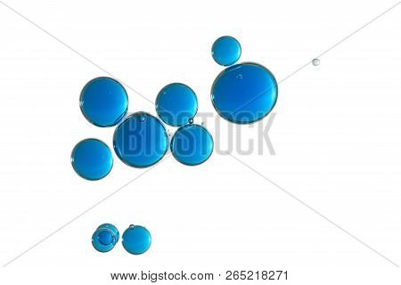 Beautiful Blue Bubbles Over A White Surface.