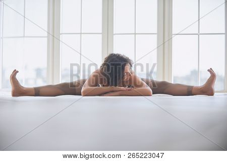 Beautiful Young Woman Practices Yoga Asana Samakonasana Straight Angle Posture In The Light Yoga Stu