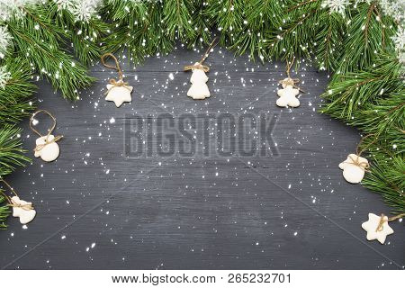 Christmas Frame With Sugar Glazed Cookies, Natural Pine Fir Tree Branches And On Dark Background Wit