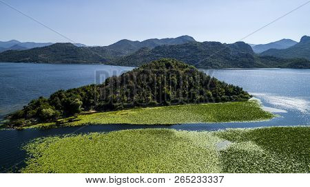 Aerial View Of The Beautiful Landscape Of Lake Skadar In The Mountain On A Sunny Day. Montenegro. Th