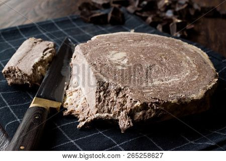 Turkish Chocolate Halva Or Helva With Knife And Chocolate Pieces