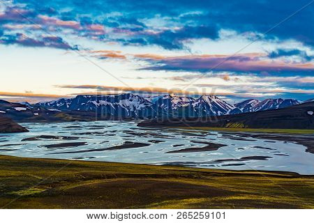 Volcanic Landscape Of The Mountain And Frozen Lake In The Evening At The Central Highlands Of Icelan