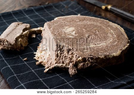 Turkish Chocolate Halva Or Helva With Knife And Chocolate Pieces