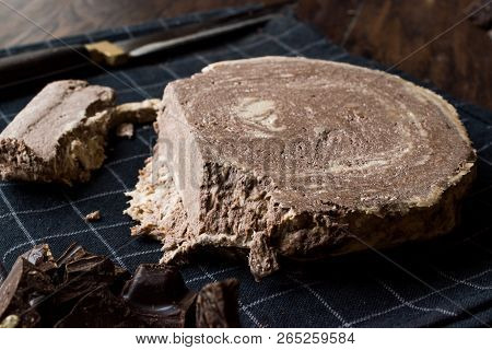 Turkish Chocolate Halva Or Helva With Knife And Chocolate Pieces