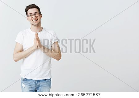 Lend Me Some Money Friend. Portrait Of Charming Sincere And Cute Young Male Brunet In Glasses Smilin