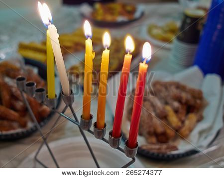 Beautiful Hanukkah Menorah Chanukkiah With Glowing Candles In A Window