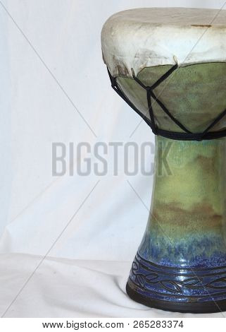 Right Side Angle Of An Of An African Doumbek Drum Against A White Backdrop