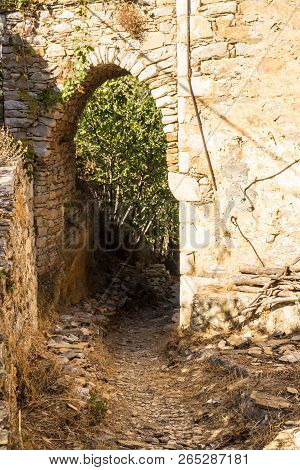 Round Doorpost In Shape Of Arch, Old Abandoned Ruins, Greece, Nature.
