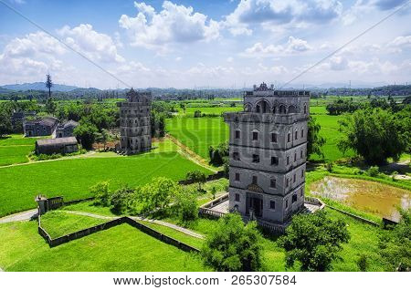 The Historic Buildings And A Rice Paddy At Kaiping Diaolou In Zili Village In Kaiping China In Guang